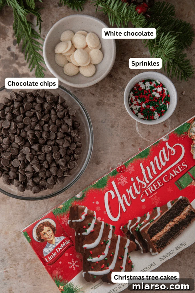 Ingredients including chocolate chips, white chocolate, sprinkles, and Little Debbie Chocolate Christmas Tree Cakes.