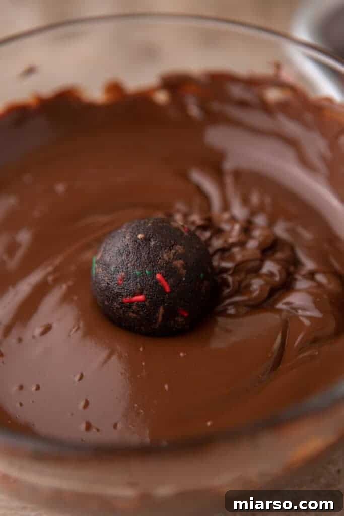 A ball being dipped in chocolate