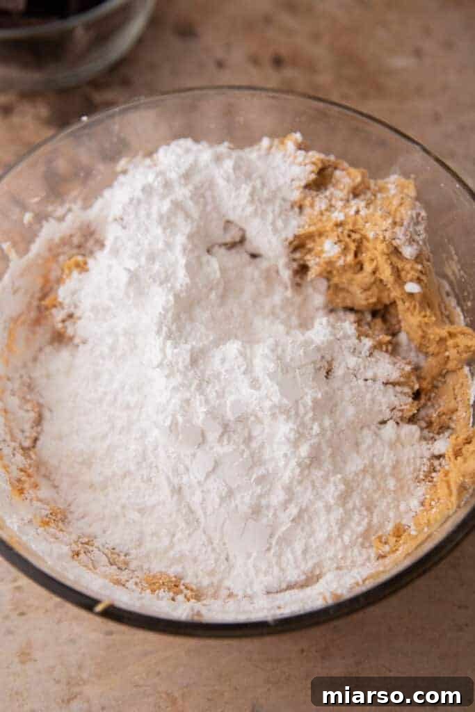 ingredients for the peanut butter layer of the buckeye bars recipe in a bowl