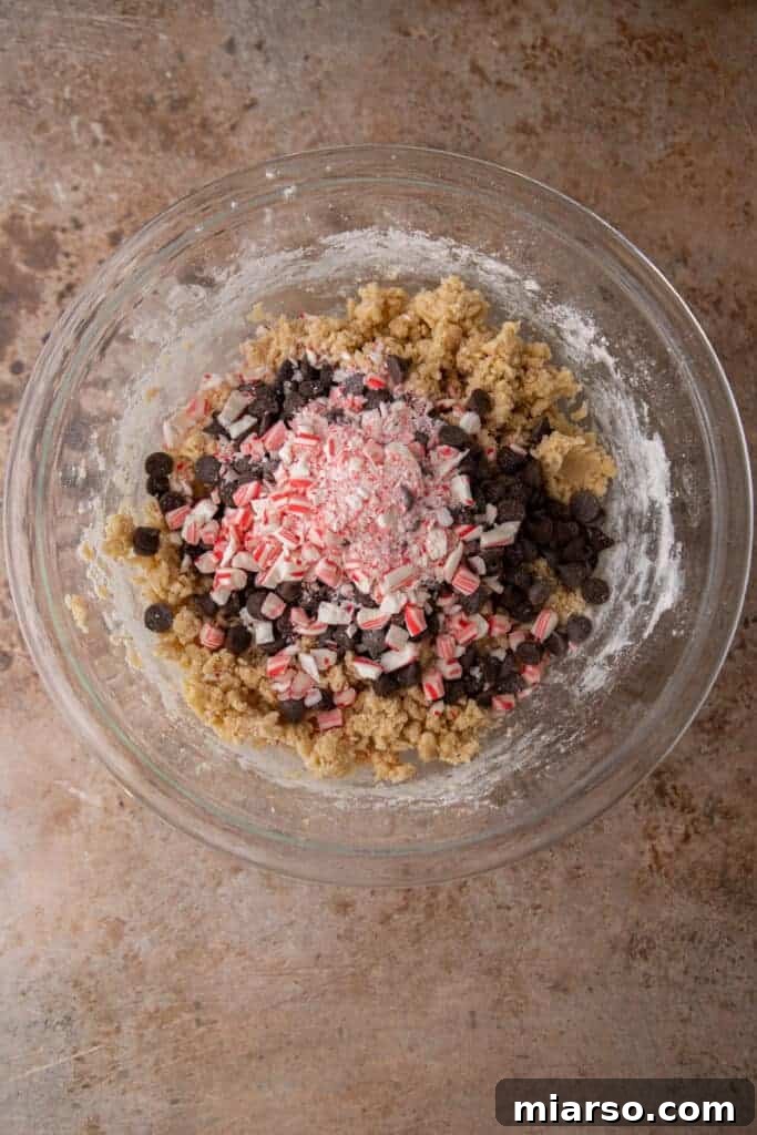 Dry ingredients like flour, corn starch, baking soda, and salt waiting to be combined in a bowl.