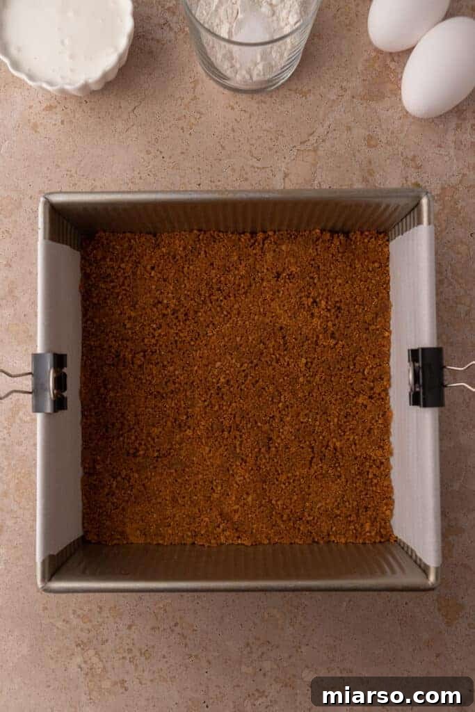 The gingersnap cookie crust pressed firmly into the baking pan, ready for baking.