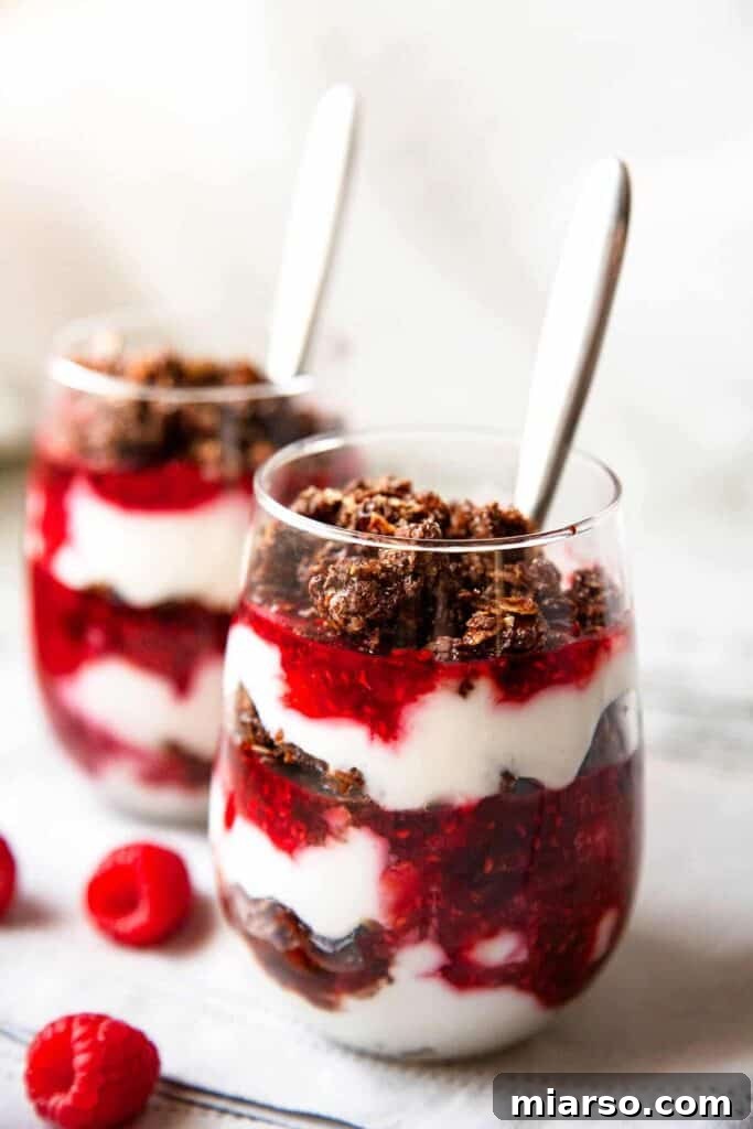 Raspberry Parfait layered with Greek yogurt and granola