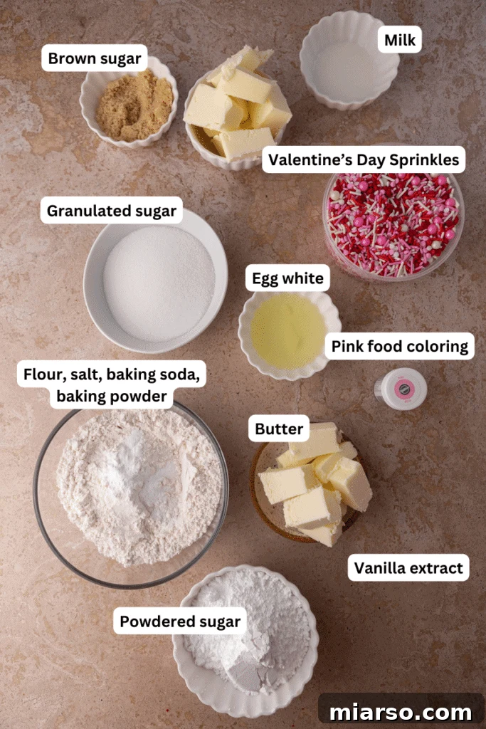 Ultimate Valentine Frosted Sugar Cookies 3 Cookie and frosting ingredients laid out on a kitchen counter