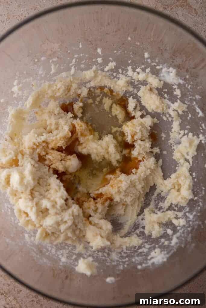 Ultimate Valentine Frosted Sugar Cookies 5 Wet ingredients in a bowl before mixing