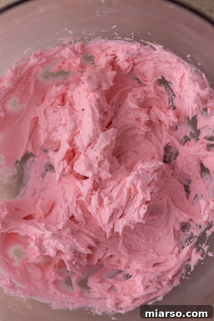 Ultimate Valentine Frosted Sugar Cookies 8 Bowl of pink buttercream frosting ready for decorating
