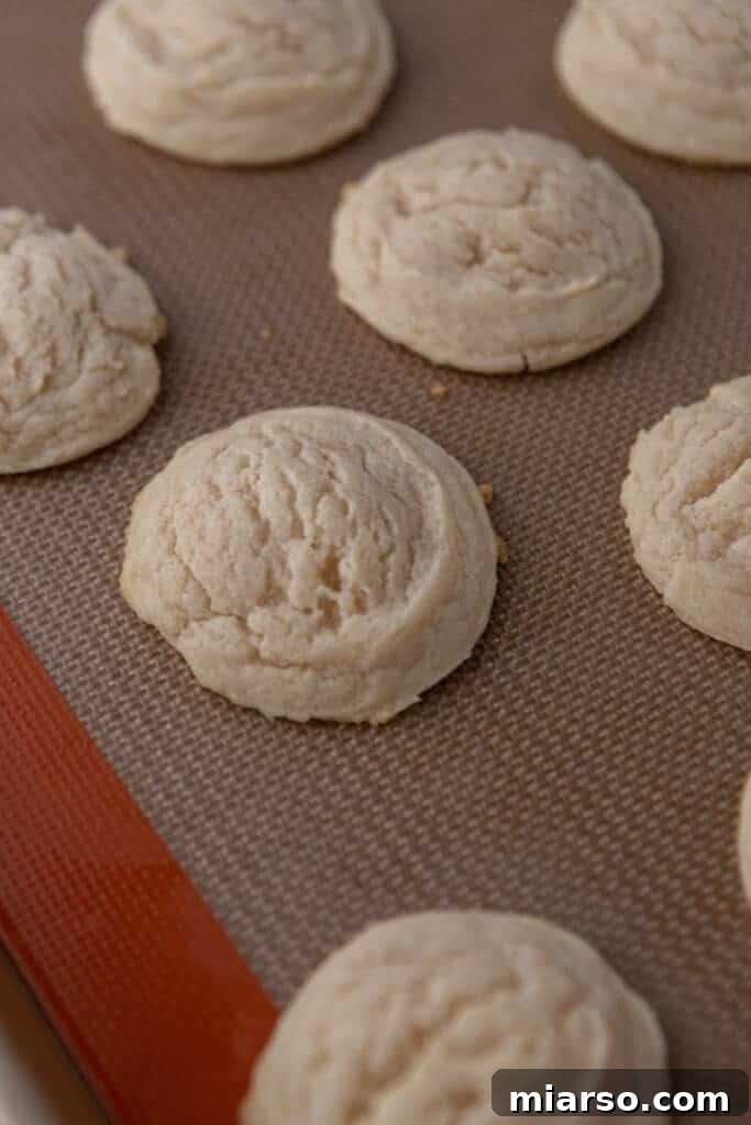 Ultimate Valentine Frosted Sugar Cookies 9 Freshly baked sugar cookies cooling on a wire rack