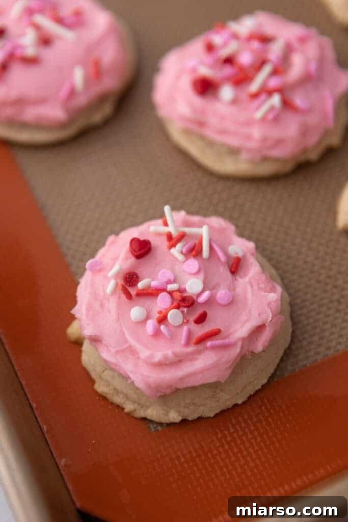 Ultimate Valentine Frosted Sugar Cookies 10 Close-up of frosted Valentine's Day sugar cookies with sprinkles