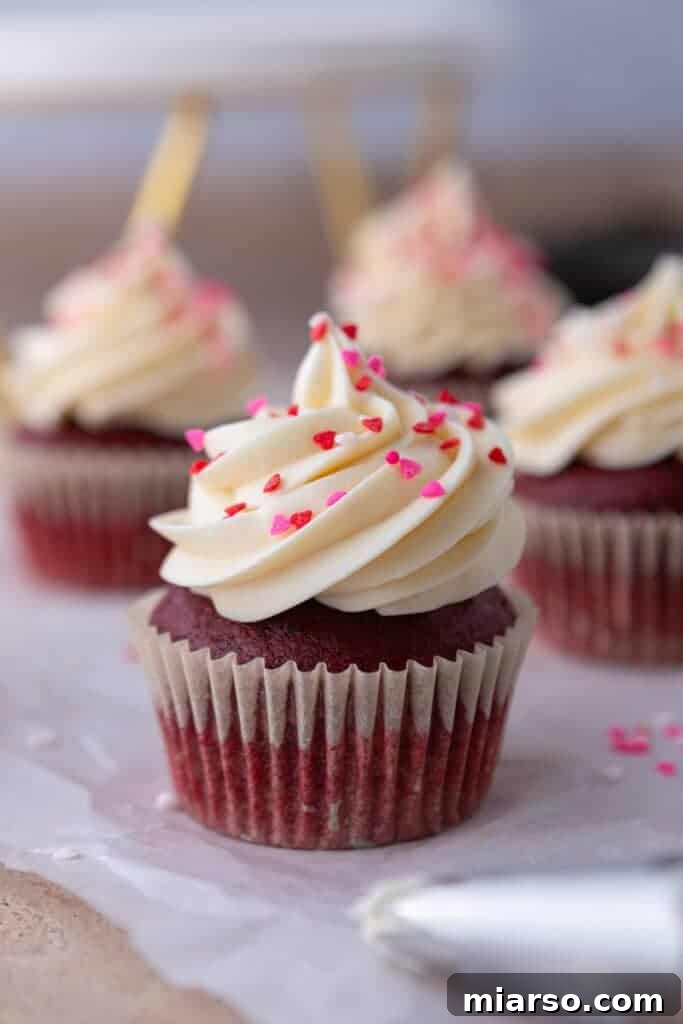 A zoomed-out shot of the small batch red velvet cupcakes, arranged beautifully on a serving plate.