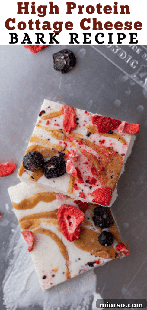 Protein Packed Cottage Cheese Freezer Bark 13 Another Pinterest pin for the healthy frozen cottage cheese bark, showing multiple squares on a plate.
