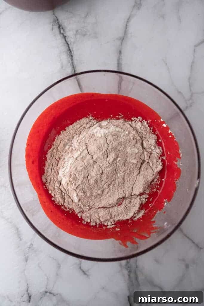 dry ingredients being combined with the wet ingredients