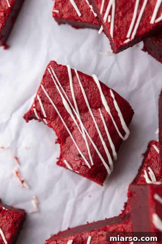 Fudgy red velvet brownies, perfectly cut and stacked for a decadent dessert.