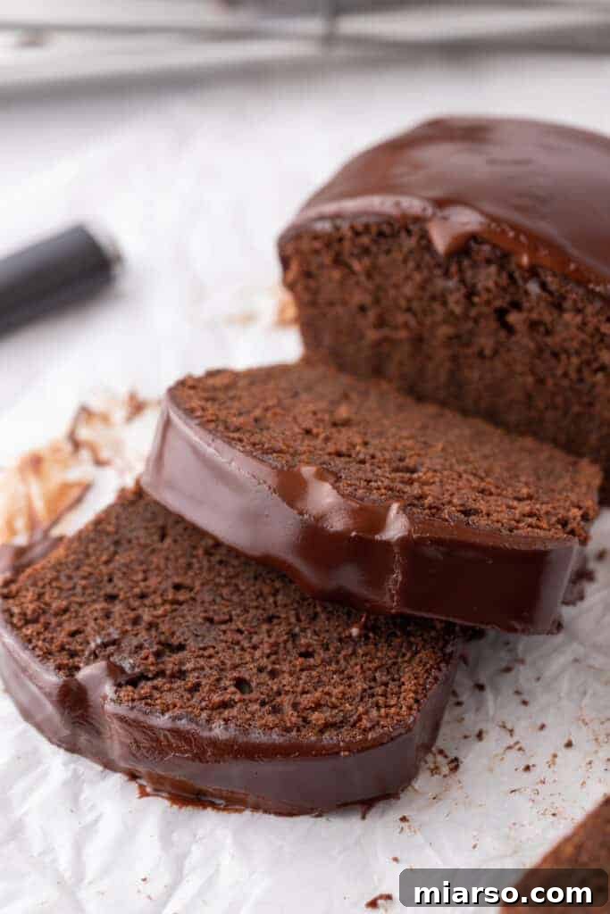 Ultimate Decadent Chocolate Pound Cake Recipe 11 Several slices of chocolate pound cake displayed on their side, showing the texture of the cake.