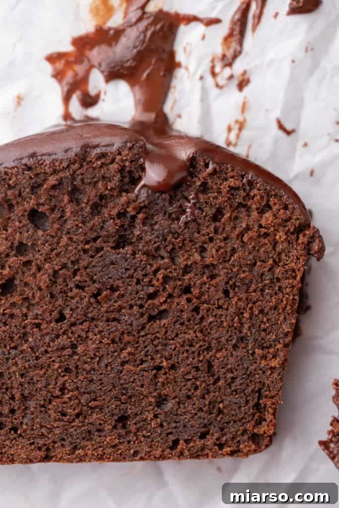 Ultimate Decadent Chocolate Pound Cake Recipe 12 A close-up shot of the chocolate pound cake recipe, highlighting its moist texture and shiny ganache topping.