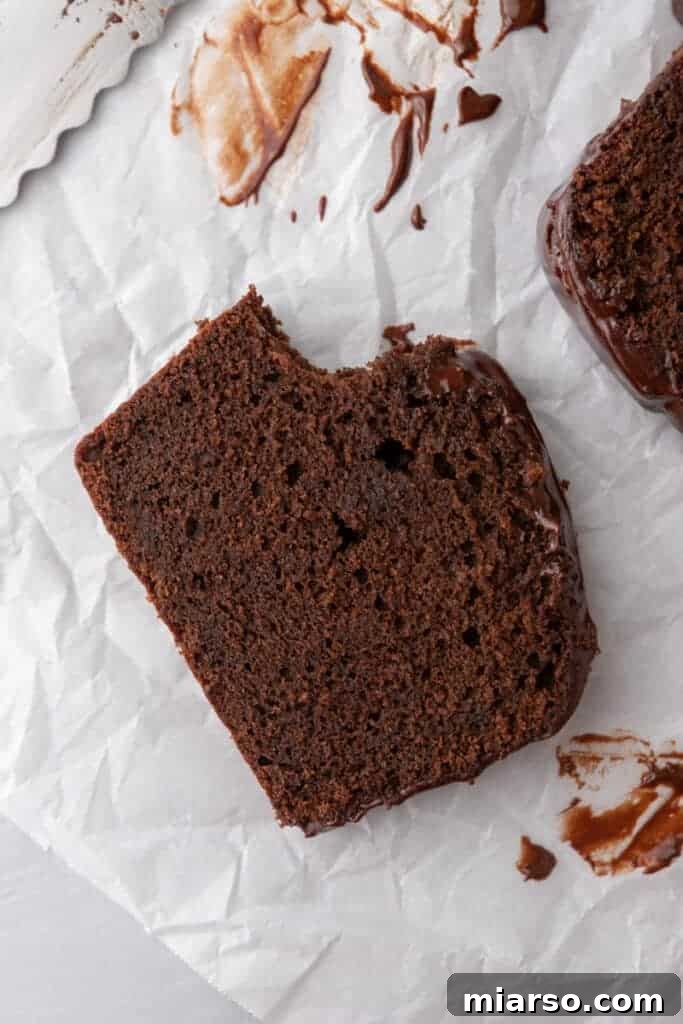 Ultimate Decadent Chocolate Pound Cake Recipe 4 A perfectly baked slice of chocolate pound cake presented on its side, showcasing its moist interior and rich color.
