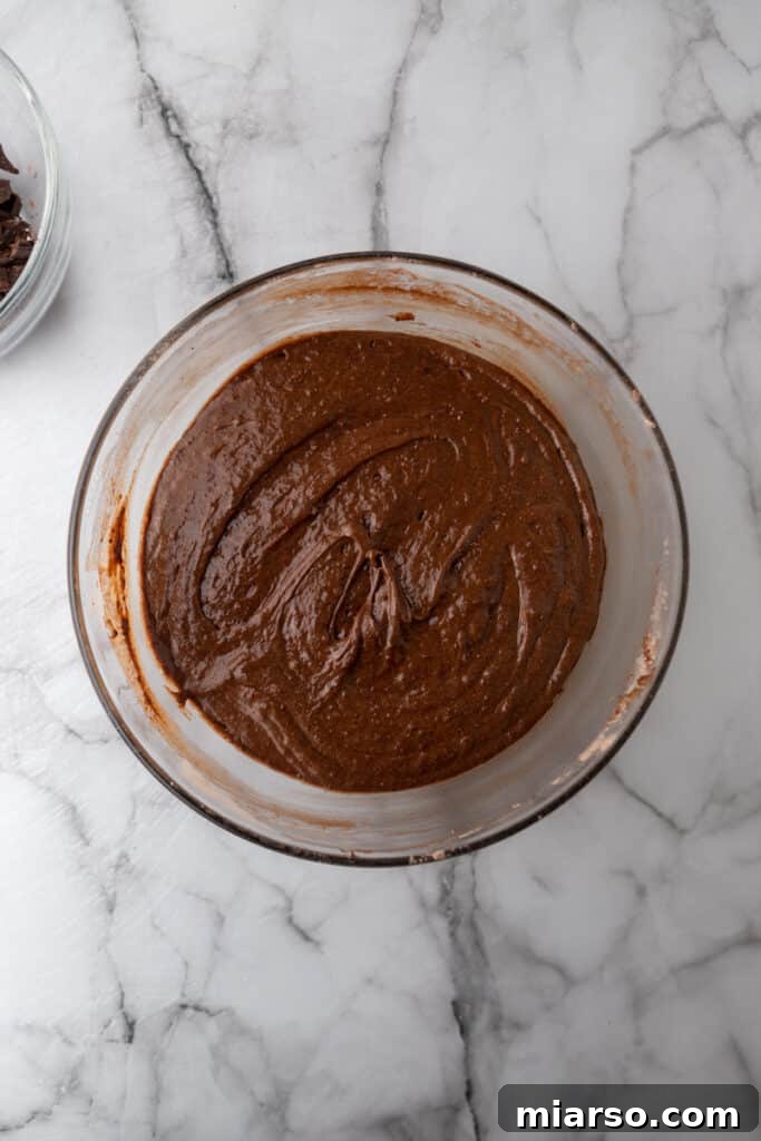 Ultimate Decadent Chocolate Pound Cake Recipe 6 Mixed ingredients in a bowl, showcasing the creamy, cohesive batter before baking.