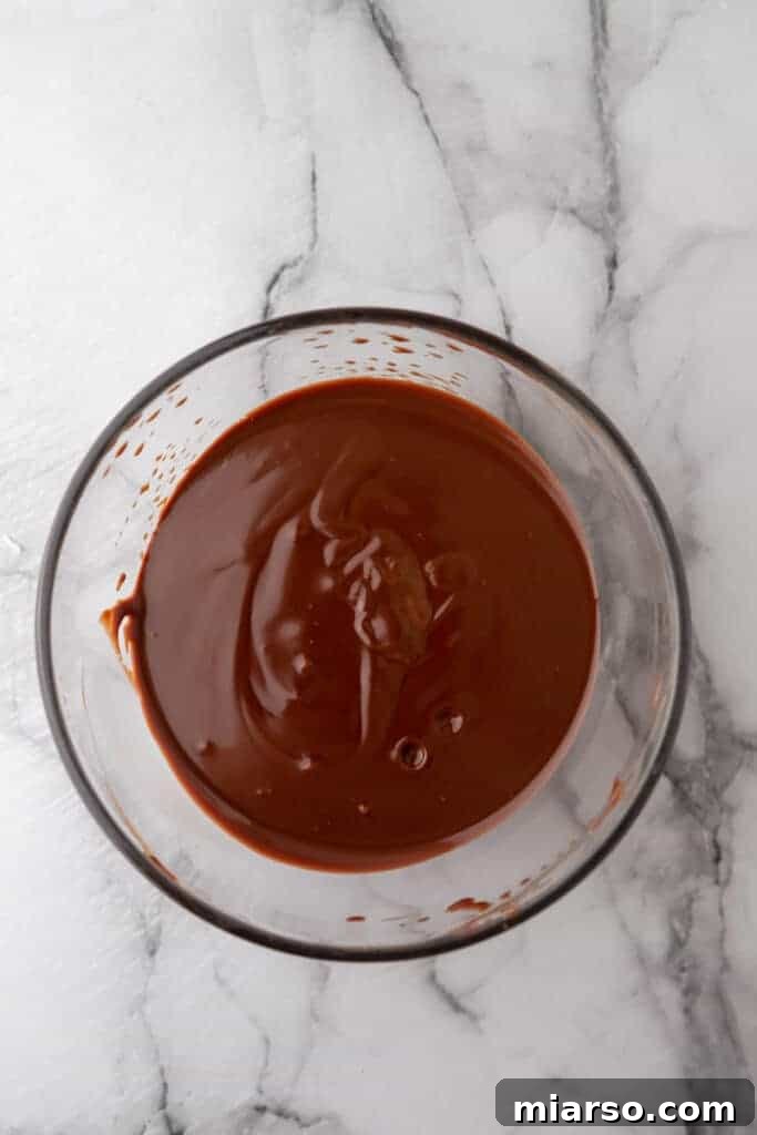 Ultimate Decadent Chocolate Pound Cake Recipe 9 Ingredients for chocolate ganache in a bowl, prepped before combining.