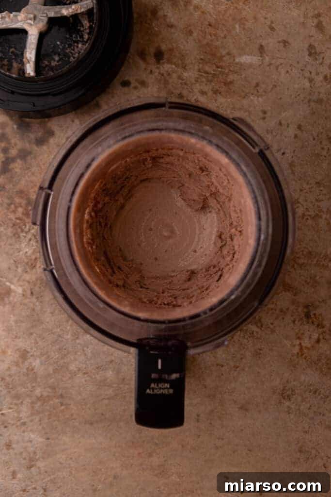 Elevate Your Protein Ninja Creami Ice Cream Perfection 5 Fully mixed protein shake and pudding mix in a Ninja Creami pint