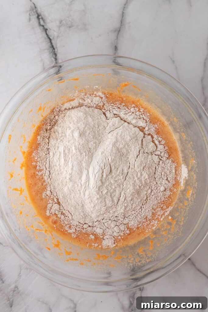 flour with batter in a clear bowl