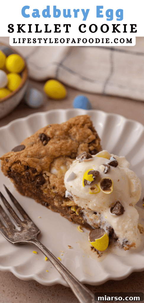 Gooey Giant Cadbury Mini Egg Skillet Cookie 15 Close-up shot of a Cadbury egg skillet cookie, highlighting the melted chocolate and vibrant mini eggs.