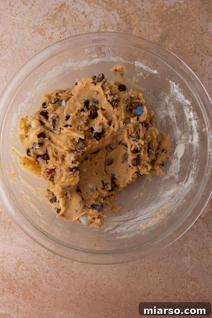 Gooey Giant Cadbury Mini Egg Skillet Cookie 8 Fully mixed cookie dough in a bowl, ready for baking.