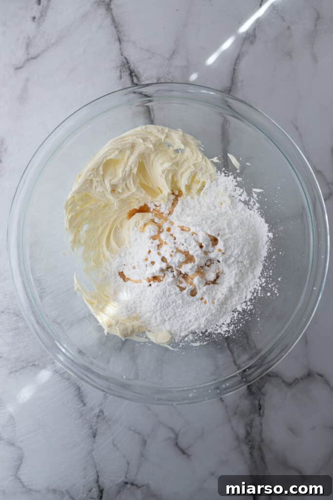 Mascarpone Frosting Perfection 5 unmixed ingredients in a bowl