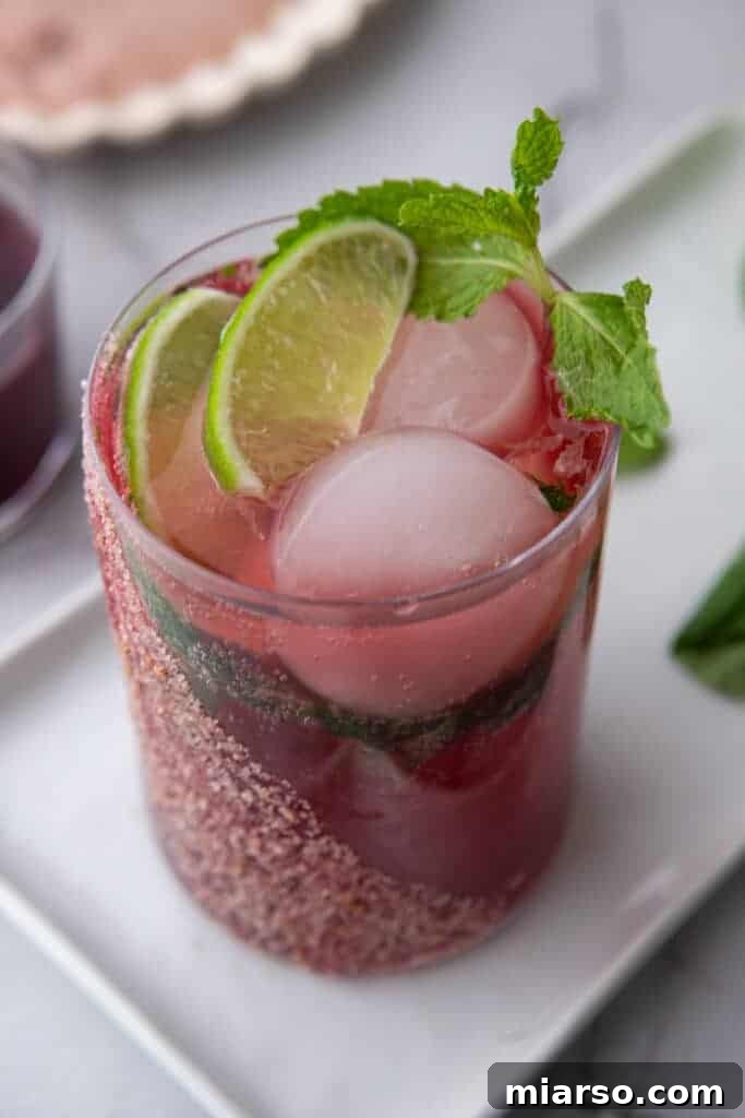 angled overhead shot of the pomegranate mocktail recipe in a glass