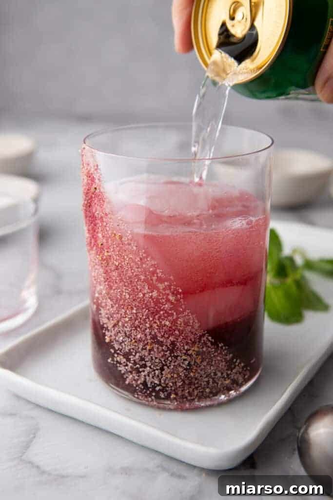 sparkling water being poured into the glass