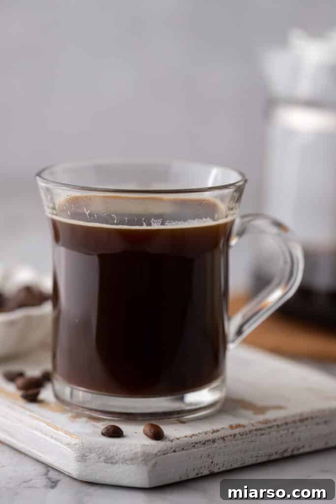 Red Eye Coffee Recipe in a glass on a coaster, ready to be enjoyed