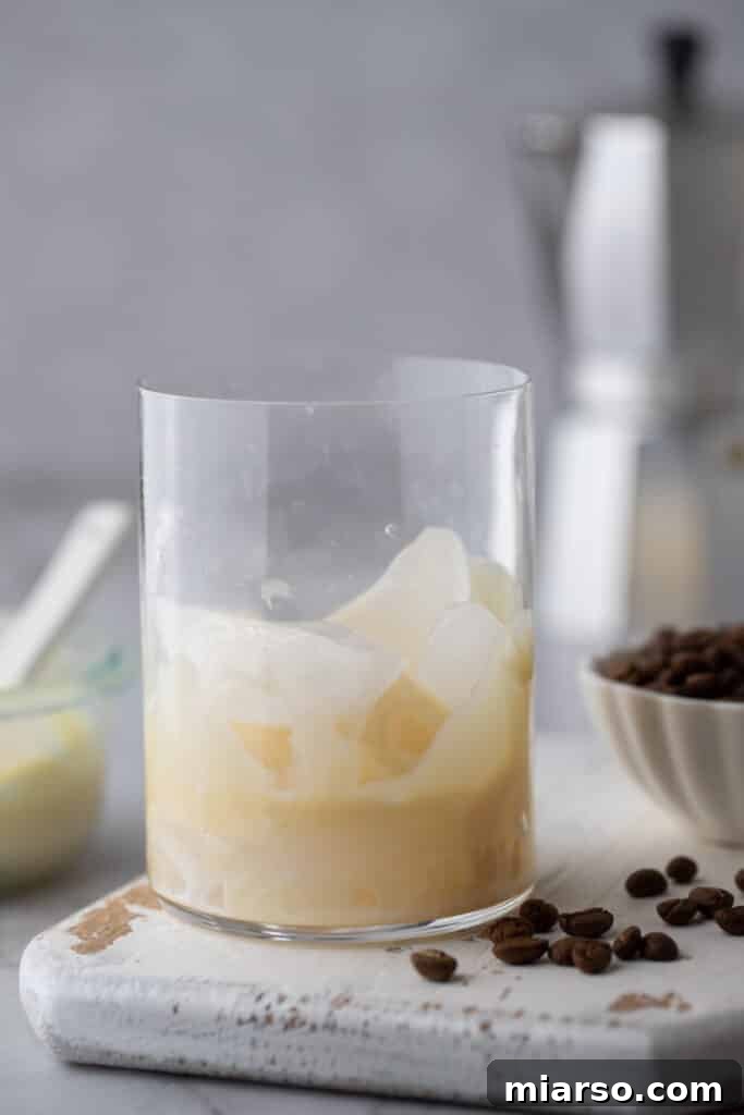 Decadent Homemade Spanish Latte Recipe 4 sweetened condensed milk in a glass with ice