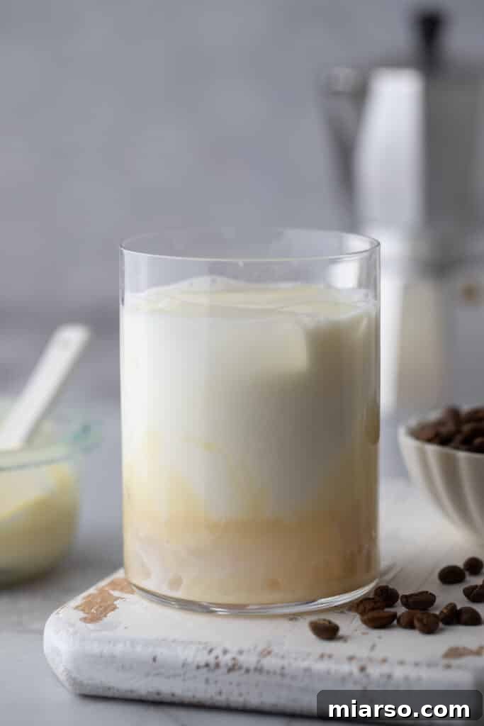 Decadent Homemade Spanish Latte Recipe 5 milk and sweetened condensed milk in a glass with ice