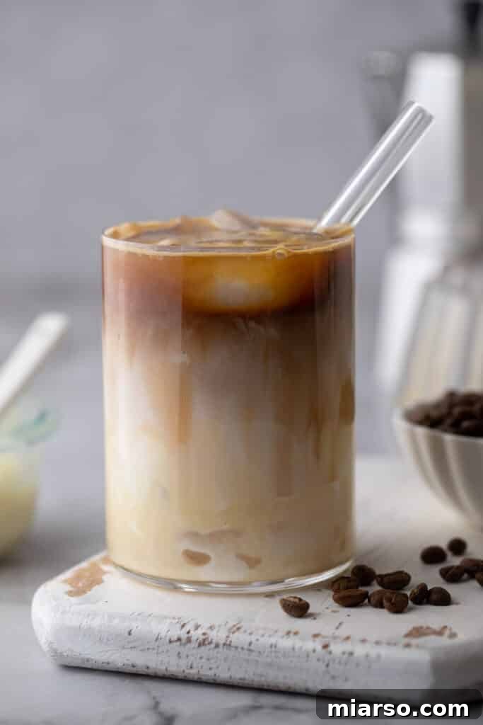 Decadent Homemade Spanish Latte Recipe 7 a spanish latte recipe in a cup with a straw