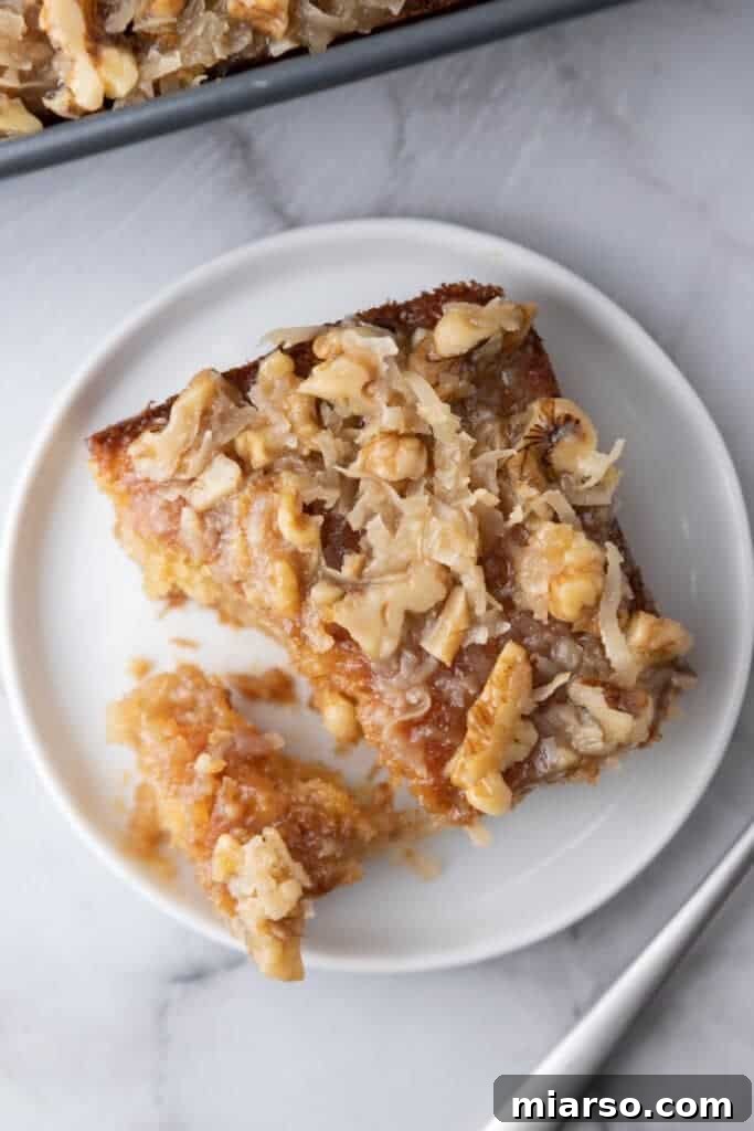 An overhead view of a perfect slice of Tornado Cake recipe on a plate, highlighting the delicious topping and moist cake.