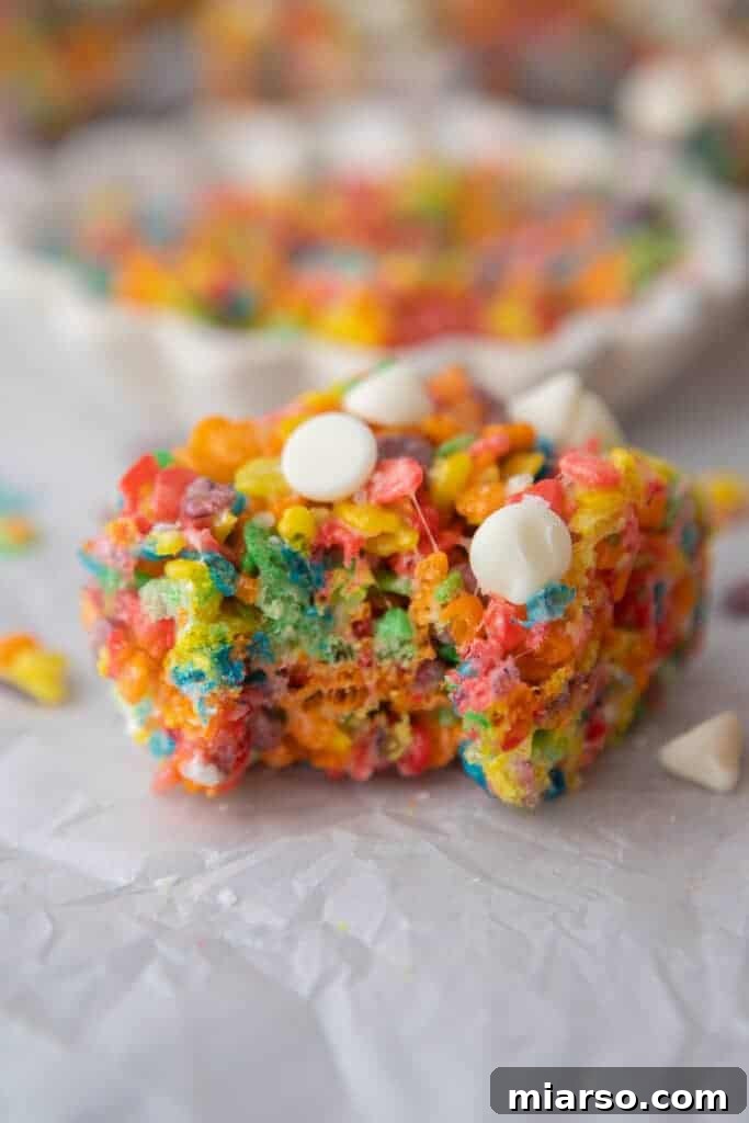Quick Colorful Fruity Pebble Krispie Treats 4 Close up of Fruity Pebbles rice krispies with a bite taken out of them