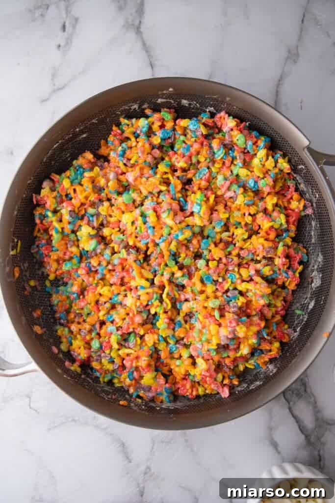 Quick Colorful Fruity Pebble Krispie Treats 6 Fruity pebbles cereal in a pan