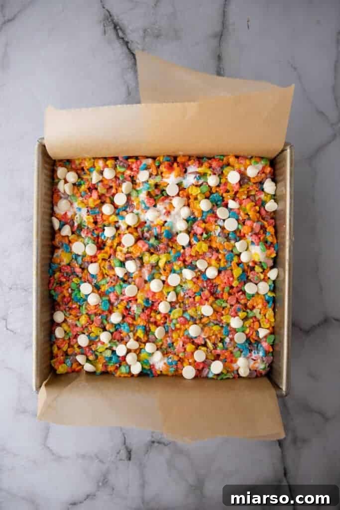 Quick Colorful Fruity Pebble Krispie Treats 7 Fruity Pebbles Rice krispies in a pan