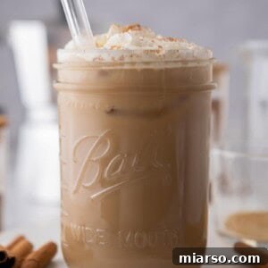 a maple latte in a glass with a straw