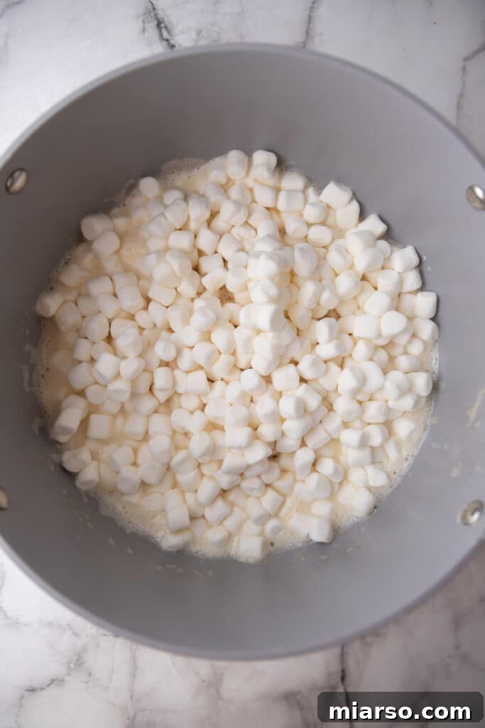 Ultimate Chocolate Rice Krispies Treats 5 marshmallows in a pot