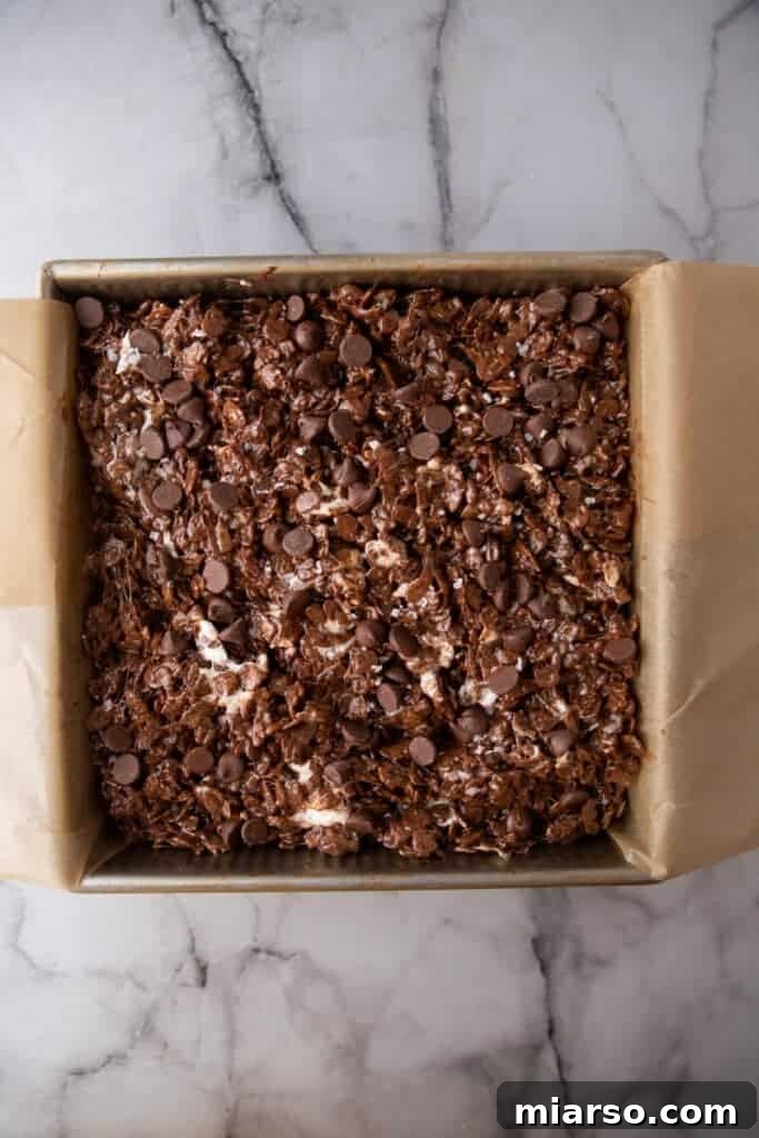 Ultimate Chocolate Rice Krispies Treats 7 cereal-marshmallow mixture packed into a square pan