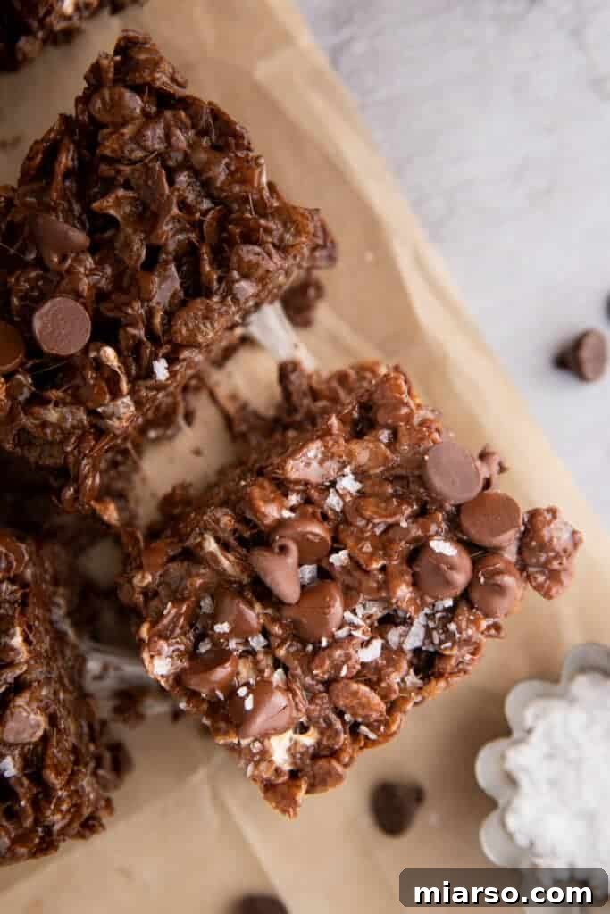 Ultimate Chocolate Rice Krispies Treats 8 two Brown Butter Chocolate Rice Krispies Treats being pulled apart
