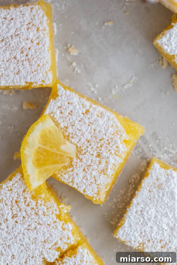 Overhead shot of the easy lemon bars recipe, showcasing a full tray of perfectly sliced squares.