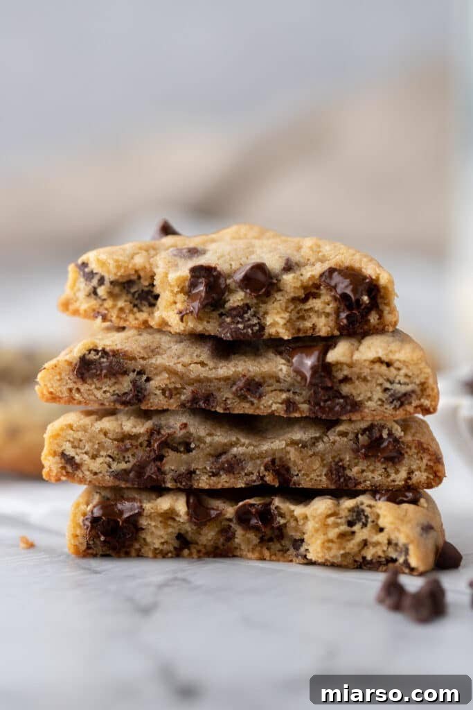 side shot of sourdough chocolate chip cookies halves stacked on each other