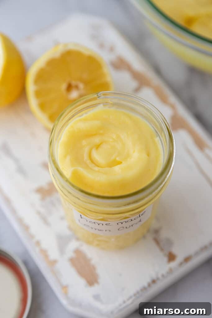 Microwave Magic: Luscious Lemon Curd in Minutes 13 Angled overhead shot of the microwave lemon curd recipe in a jar, showcasing its inviting texture.