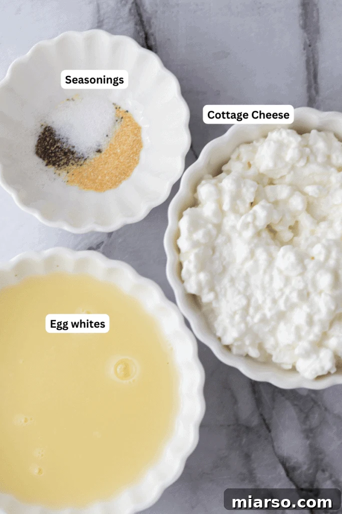 Fresh ingredients laid out on a kitchen counter, including cottage cheese, eggs, and spices, ready for making the high-protein wrap.
