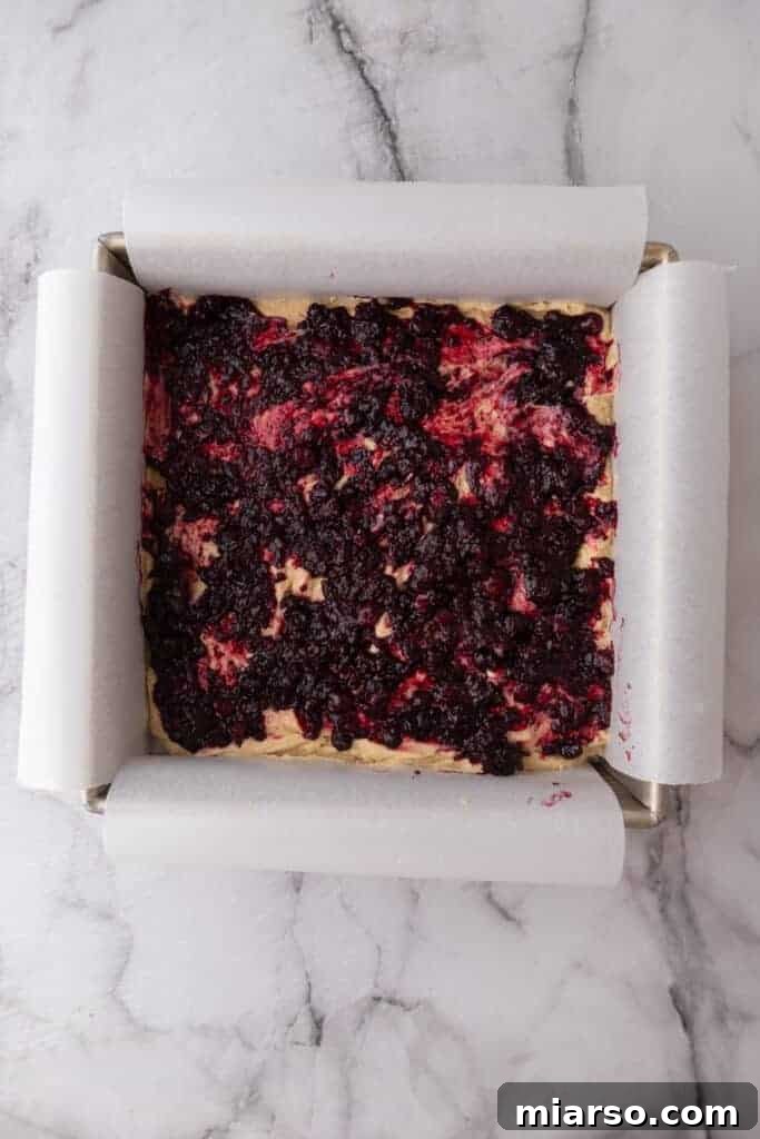 Blondie batter spread in a baking pan