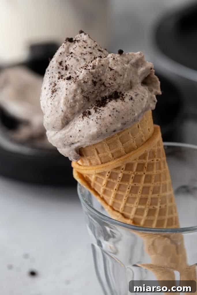 side shot of the ninja creami cookies and cream recipe on a cone