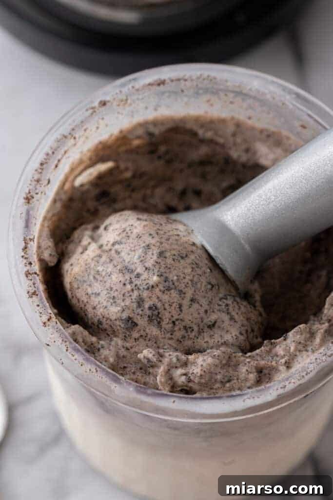 overhead shot of ice cream spoon scooping the Ninja Creami Cookies and Cream