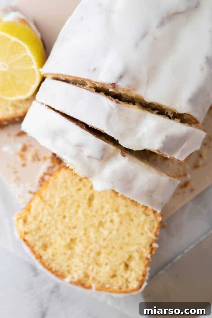 Sliced Whole Lemon Blender Cake with a lemon glaze