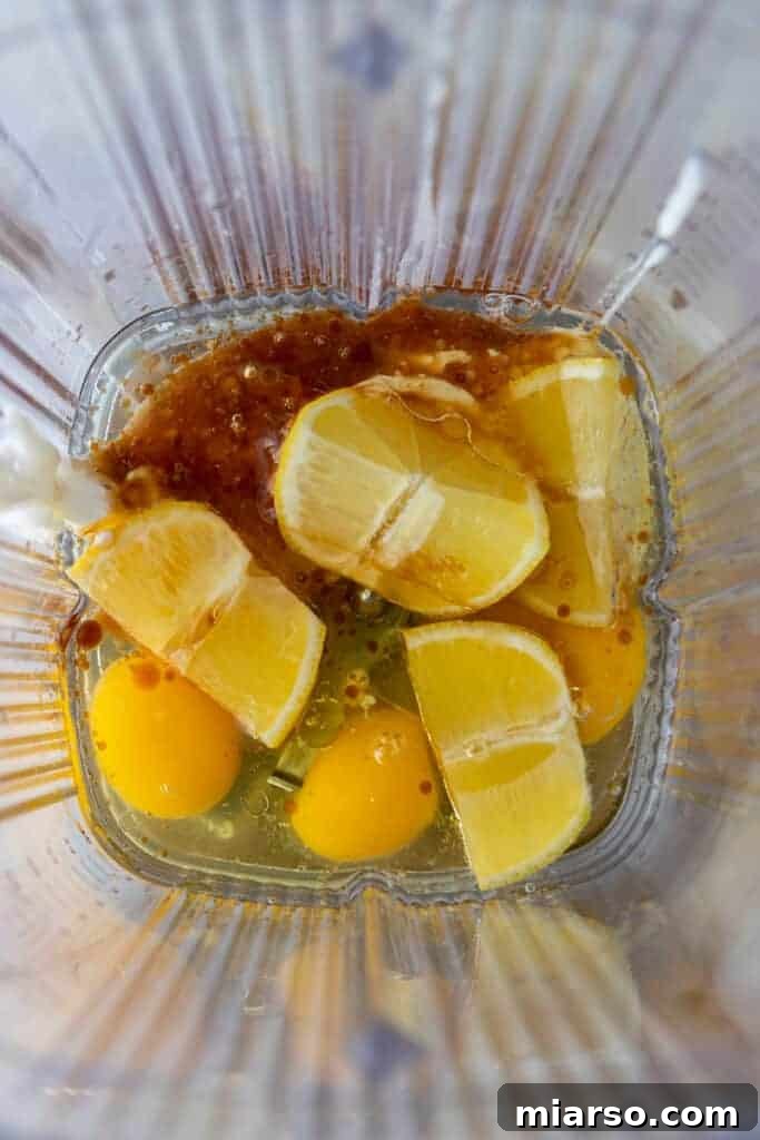 Unblended wet and dry ingredients layered in a blender