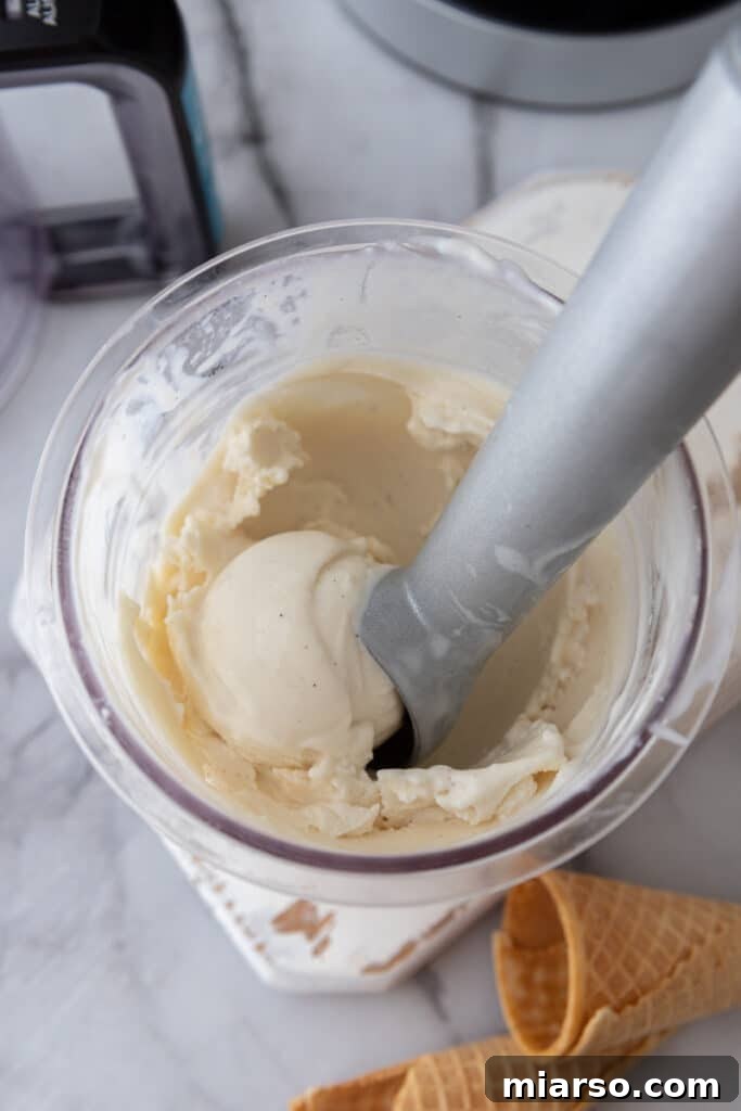 Ninja Creami frozen yogurt in a pint cup after processing, ready to be scooped.