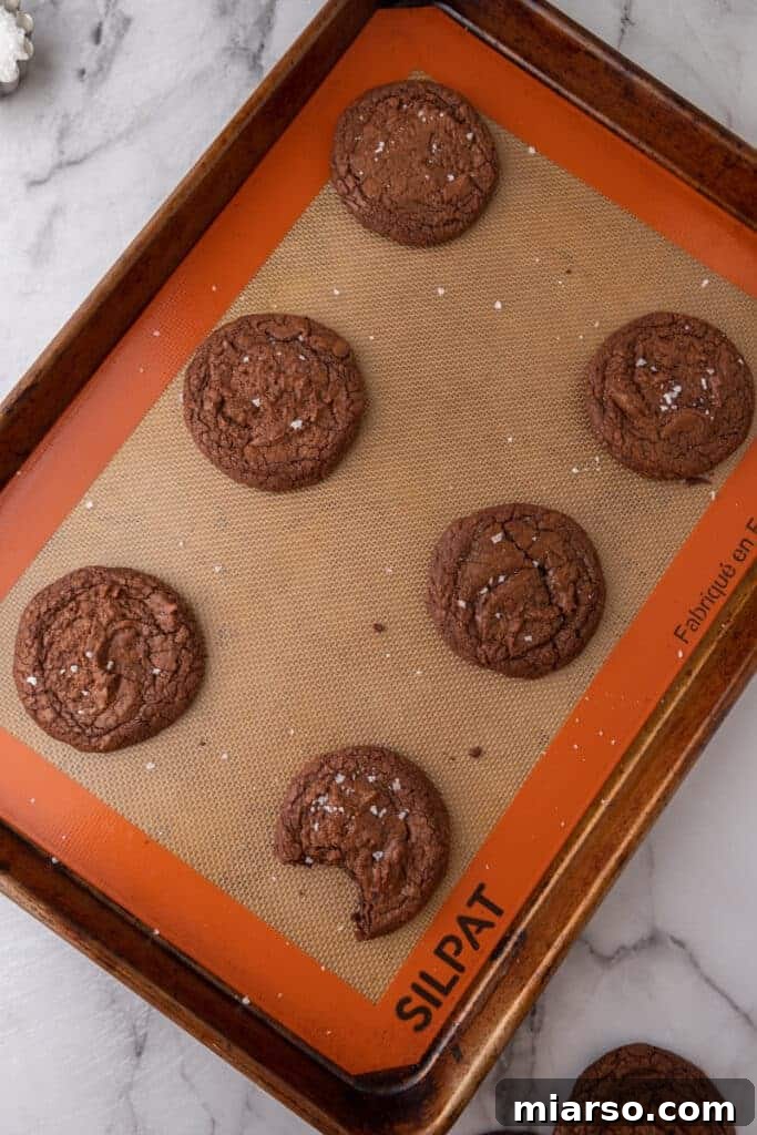 Freshly baked Brownie Cookies on a cooling rack.